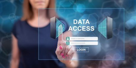 Woman touching a data access concept on a touch screen with her fingerの写真素材