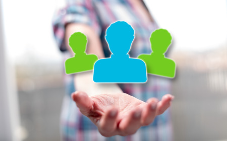 Profile concept above the hand of a woman in backgroundの写真素材