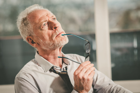 Portrait of thoughtful senior businessmanの写真素材