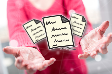 Document concept above the hands of a woman in backgroundの写真素材