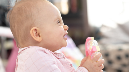 Portrait of happy cute baby girl at homeの写真素材