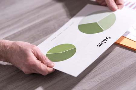 Businessman analyzing a sales pie chartの写真素材