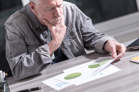 Senior businessman analyzing financial resultsの写真素材
