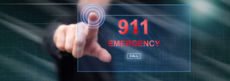 Man touching an emergency concept on a touch screen with his fingerの写真素材