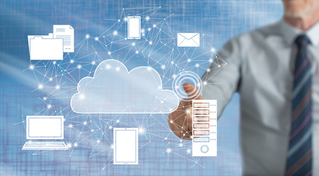 Man touching a cloud computing concept on a touch screen with his finger