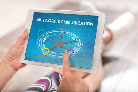 Woman using a tablet with network communication concept