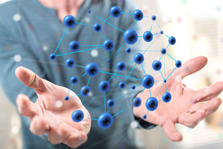 Network concept above the hands of a man in background
