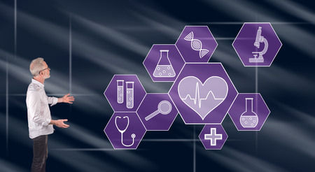 Businessman showing a medical technology concept on a wall screenの写真素材