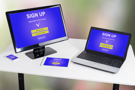 Sign up concept shown on different information technology devicesの写真素材