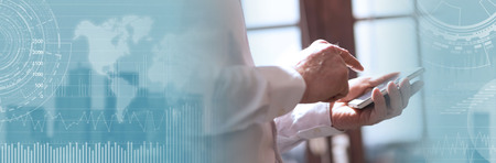 Standing businessman using mobile phone. panoramic banner