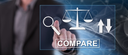 Man touching a compare concept on a touch screen with his fingerの写真素材