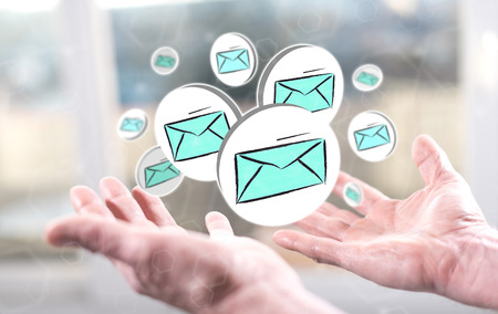 E-mail concept above the hands of a manの写真素材