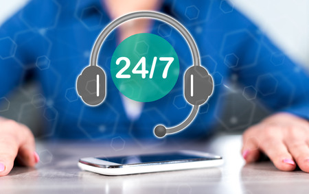 Smartphone with support concept between hands of a woman in backgroundの写真素材