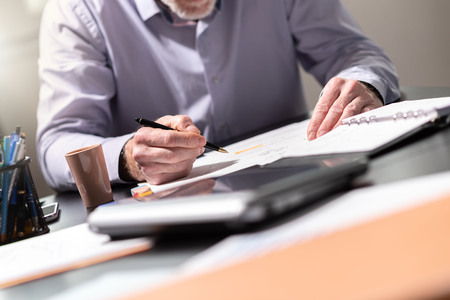 Businessman working on documents in office