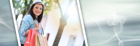 Pretty young woman walking with shopping bags in hand, light effect. panoramic bannerの写真素材