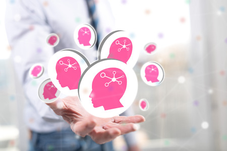 Artificial intelligence concept above the hand of a man in backgroundの写真素材