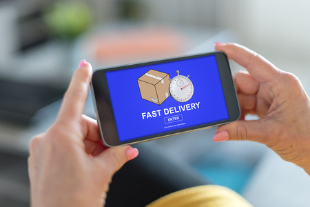 Smartphone screen displaying a fast delivery conceptの写真素材