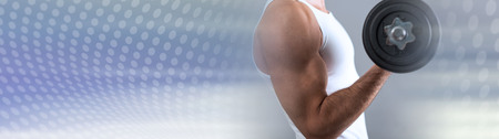 Athletic man working with heavy dumbbell. panoramic bannerの写真素材