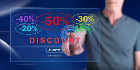 Man touching a discount concept on a touch screen with his fingerの写真素材