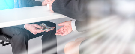 Businessman giving money under a table. multiple exposure