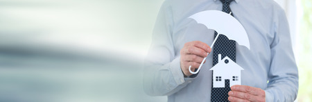 Symbol of home coverage by a general agent. panoramic bannerの写真素材