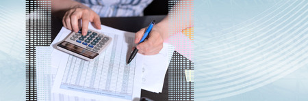 Female accountant using calculator in office. panoramic bannerの写真素材