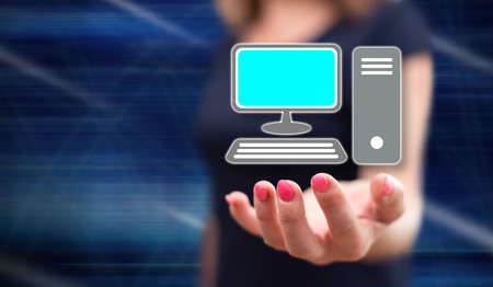 Computer concept above the hand of a woman in backgroundの写真素材