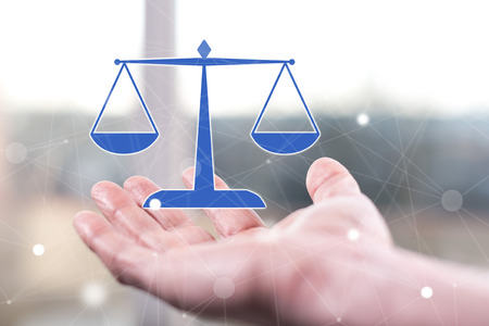 Law concept above a hand of a manの写真素材