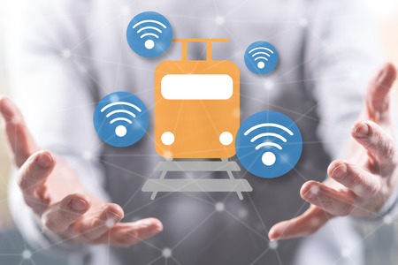 Smart train concept above the hands of a man in backgroundの写真素材
