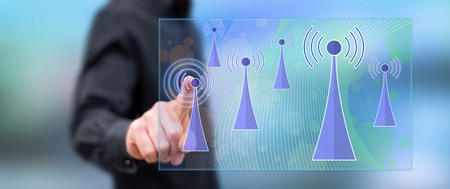 Man touching a wifi signal concept on a touch screen with his finger