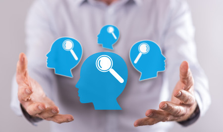 Analysing concept above the hands of a man in background