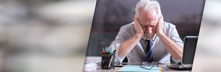 Portrait of tired businessman sitting in office. panoramic bannerの写真素材