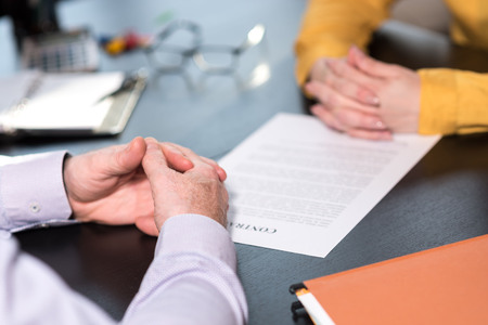 Situation of business negotiation between businesswoman and businessmanの写真素材