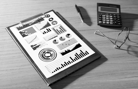 Financial analysis concept on a clipboard with a calculatorの写真素材