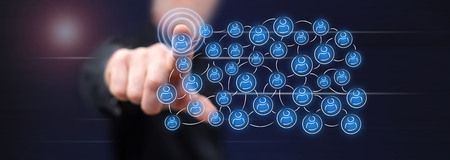 Man touching a social network concept on a touch screen with his fingerの写真素材