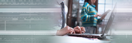 Businessman working on laptop in office. panoramic banner