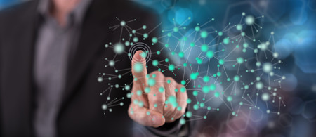 Man touching a virtual network on a touch screen with his finger