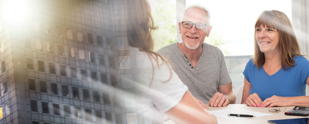 Senior couple meeting financial adviser for investment; multiple exposureの写真素材