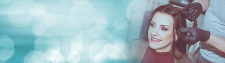 Hairdresser coloring client hair. panoramic bannerの写真素材