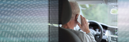 Man driving using smartphone. panoramic banner