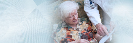 Doctor explaining a prescription to an old woman at home. panoramic bannerの写真素材