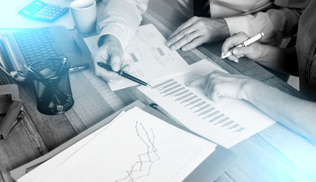 Two business people working together in officeの写真素材