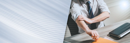 Businessman rolling up his sleeves, concept of motivation; panoramic bannerの写真素材