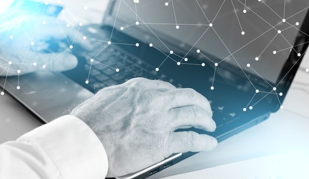 Businessman hands typing on laptop computer