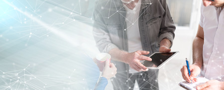 Coworkers having a business discussion in office. multiple exposureの写真素材