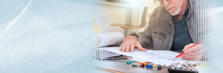 Architect working on plans at office, light effet. panoramic bannerの写真素材