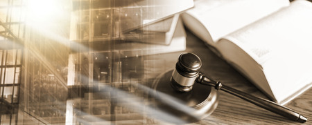 Judge gavel with law books; multiple exposure