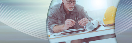 Architect working on plans at office, light effet. panoramic banner