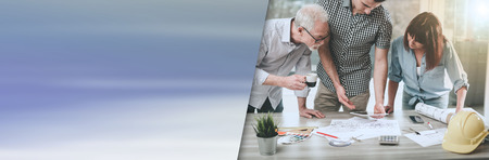 Architects working on plans at office, light effect; panoramic banner