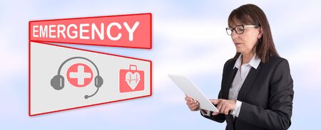 Woman using digital tablet with emergency concept on background